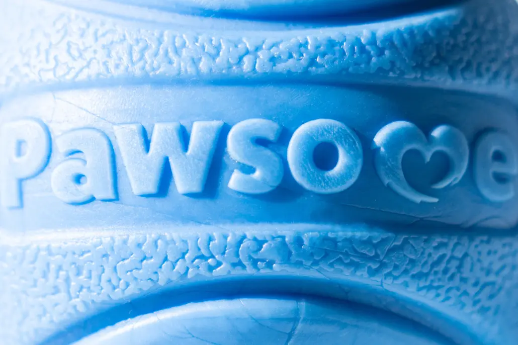 Close-up of The Pawsome Ball\s textured surface, designed for easy grip and to be safe on a dog\s teeth and gums.